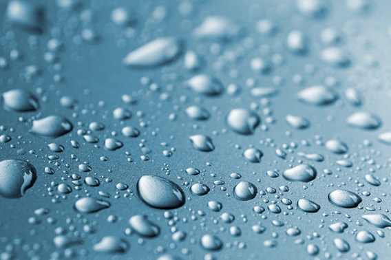 Water drops on a blue surface