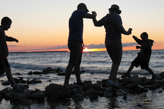Silhouette of people in Lake Michigan at Welcker's Point in Peninsula State Park.