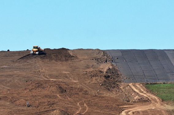 A bulldozer on a landfill